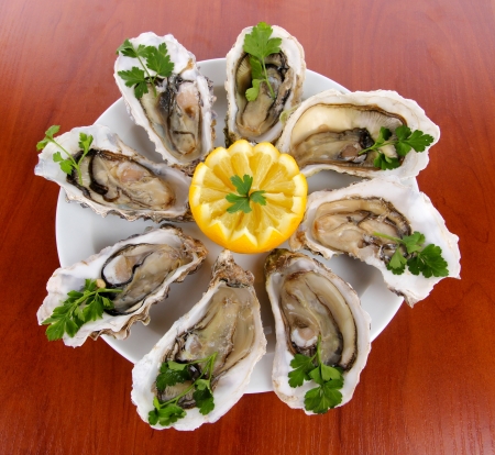 Oysters on wooden backgroundの写真素材