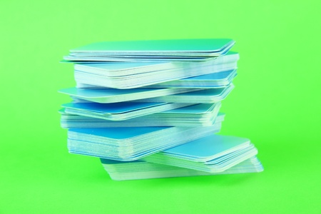 Stack of business cards, on color backgroundの写真素材