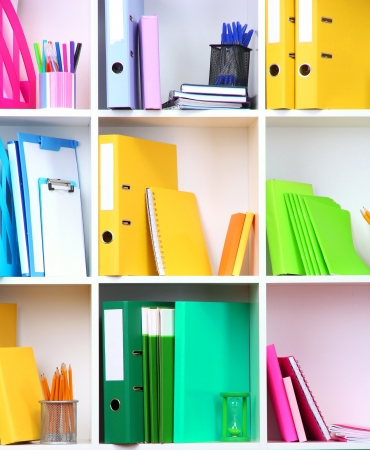 White office shelves with different stationery, close upの写真素材