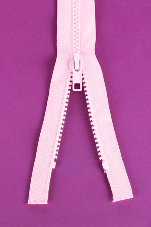 Zipper on purple backgroundの写真素材