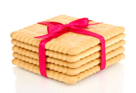 Sweet cookies tied with pink ribbon isolated on whiteの写真素材