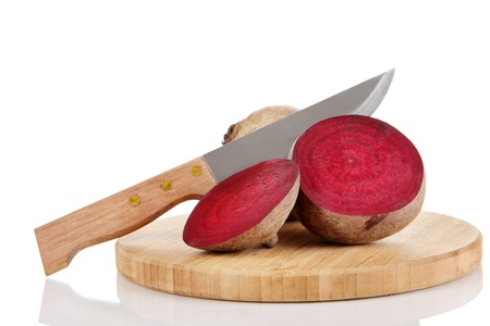 Sliced beetroot on board isolated on whiteの写真素材