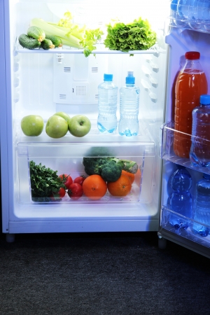 Open refrigerator with vegetarian foodの写真素材