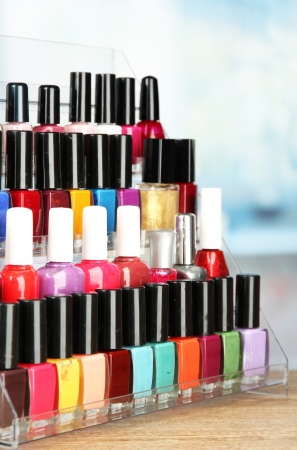 Bright nail polishes on shelf in beauty salonの写真素材