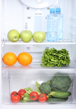 Open refrigerator with vegetarian foodの写真素材