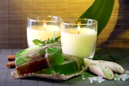 Hand made soap and candles on bamboo mat backgroundの写真素材