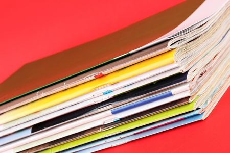 Many magazines on red backgroundの写真素材