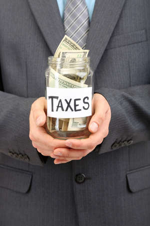 Young businessman with money isolated on white
の写真素材