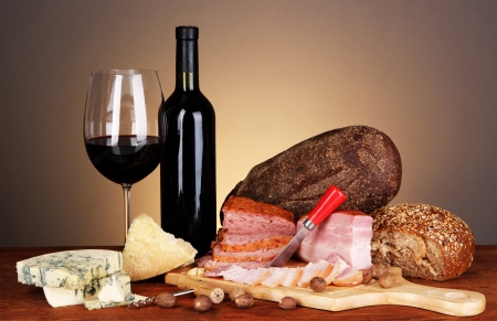 Exquisite still life of wine, cheese and meat productsの写真素材