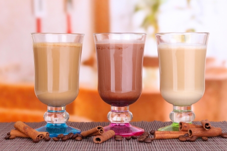 Layered coffee in glass on table on bright backgroundの写真素材