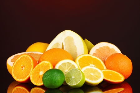 Lots ripe citrus on dark color backgroundの写真素材