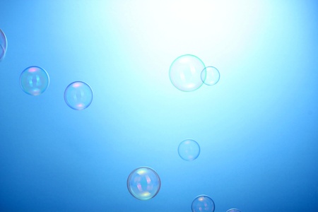 Soap bubbles on blue background