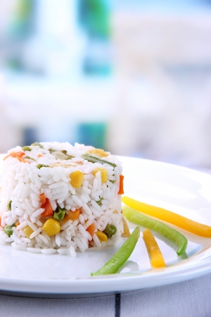 Delicious risotto with vegetables on table in cafeの写真素材