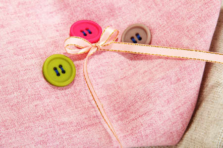 Three buttons on light  cloth