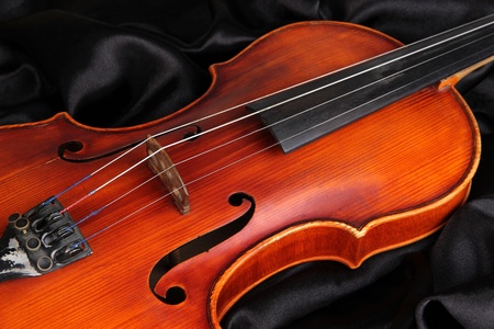 Classical violin on fabric backgroundの写真素材