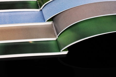 Many bright open magazines close-up