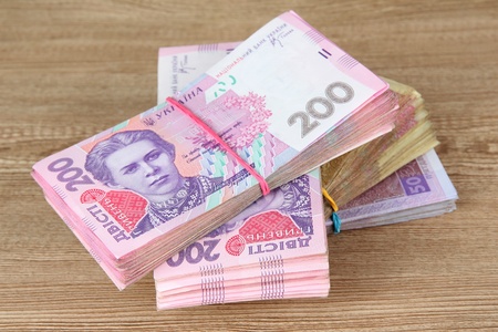 Ukrainian money on wooden backgroundの写真素材