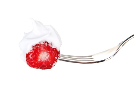 Strawberry with cream on fork, isolated on whiteの写真素材