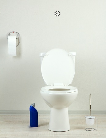 White toilet bowl and  cleaner bottle in a bathroomの写真素材