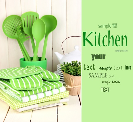 Kitchen settings: utensil, potholders, towels and else  on wooden tableの写真素材