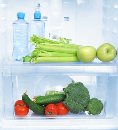 Open refrigerator with vegetarian foodの写真素材