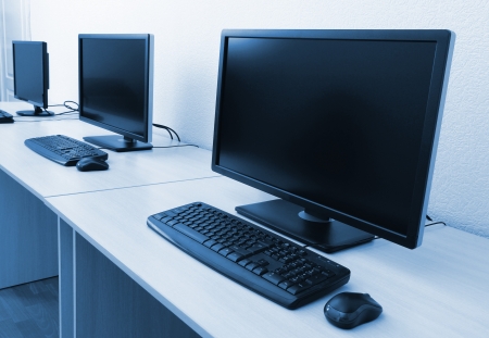 Computers on tables in roomの素材 [FY31019974398]