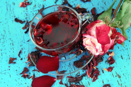 Herbal tea in glass cup, on color wooden backgroundの写真素材