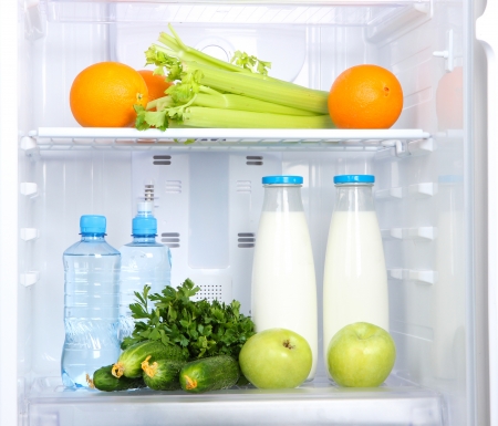 Open refrigerator with vegetarian foodの写真素材