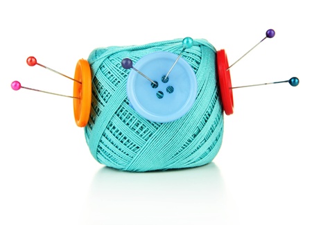Colorful buttons and wool balls, isolated on whiteの写真素材