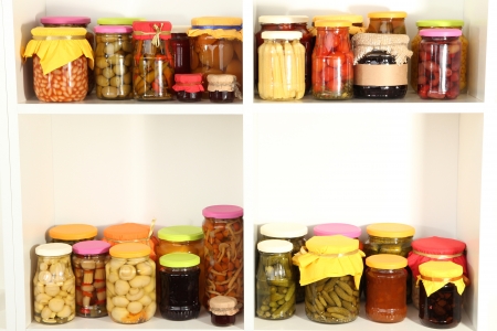 Different conservations on white shelvesの写真素材