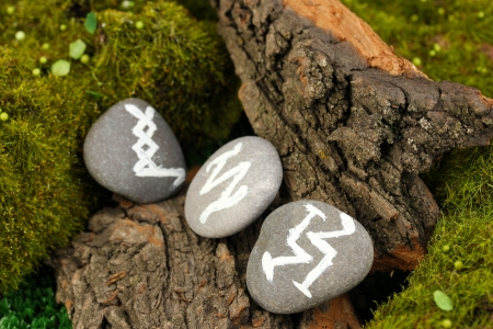 Fortune telling  with symbols on stone close upの写真素材
