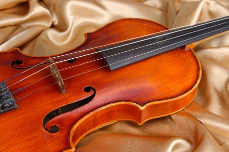 Classical violin on fabric backgroundの写真素材
