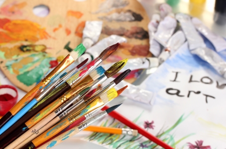 Many brush in paint on bright backgroundの写真素材