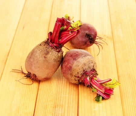Young beets on wooden table close-upの写真素材