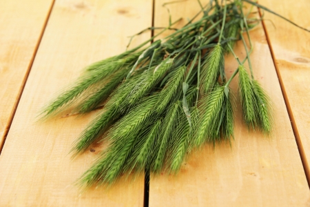 Many spikelets on wooden backgroundの写真素材