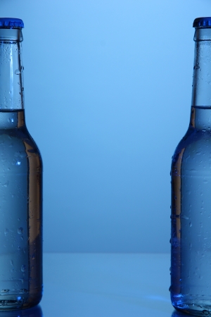 Water bottles on blue backgroundの写真素材