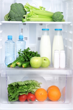 Open refrigerator with vegetarian foodの写真素材