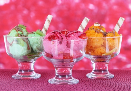 Delicious ice cream on table on bright backgroundの写真素材