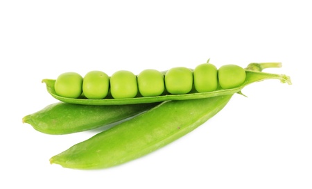 Sweet green peas isolated on whiteの写真素材