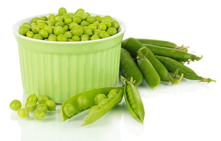 Sweet green peas in bowl isolated on whiteの写真素材