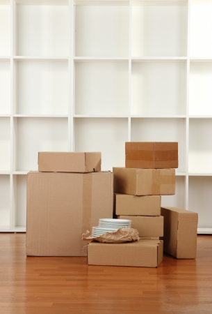 Moving boxes in empty roomの写真素材