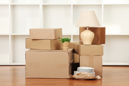 Moving boxes in empty roomの写真素材