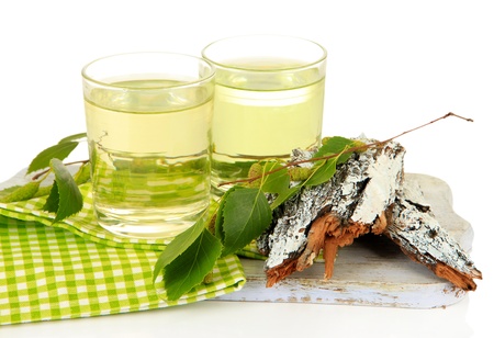 Glasses of birch sap, isolated on whiteの写真素材