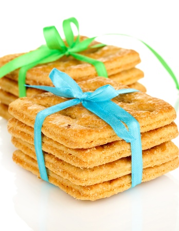 Sweet cookies tied with colorful ribbons isolated on whiteの写真素材