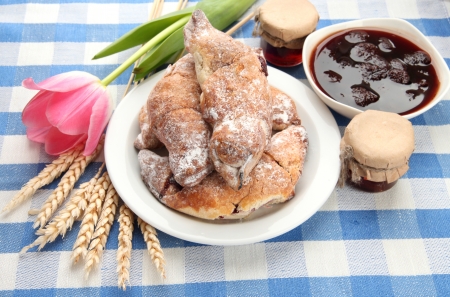 Taste croissants and jam, on tablecloth
の写真素材