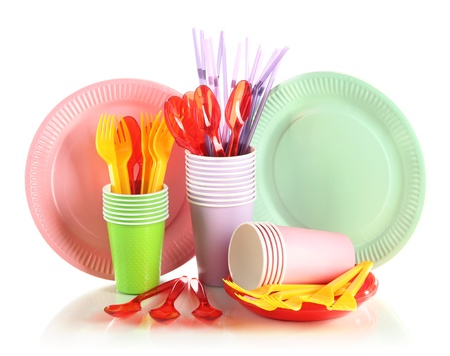 Multicolored plastic tableware isolated on whiteの写真素材