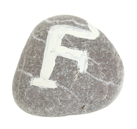 Fortune telling  with symbols on stone isolated on whiteの写真素材