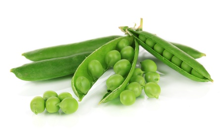 Sweet green peas isolated on whiteの写真素材