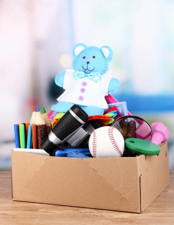 Children property in carton on table in roomの写真素材