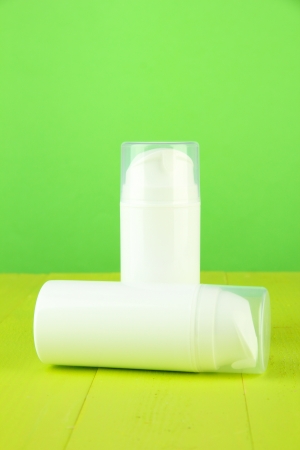 Bottle with cream, on color backgroundの写真素材